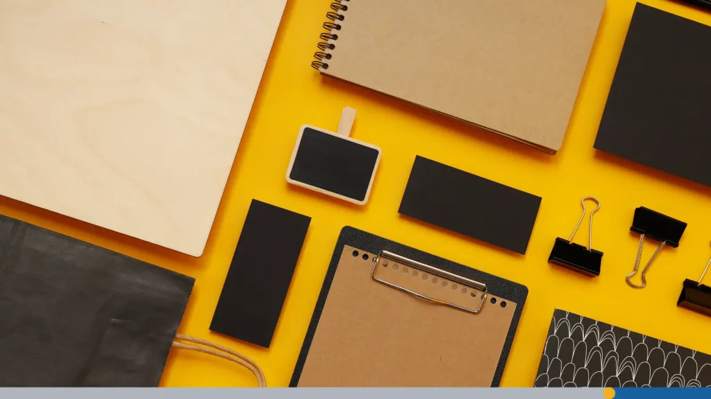 Branded office supplies on an orange background 