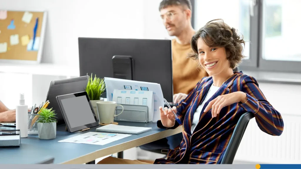 Smiling employee at a desk