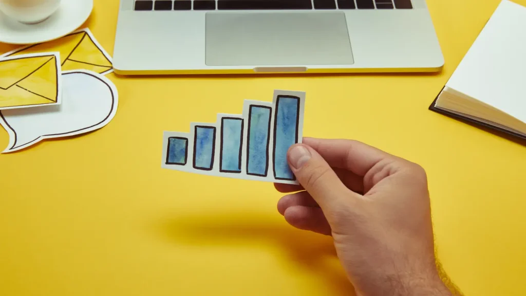Man holding a paper chart sign