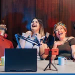 Group of podcasters laughing together