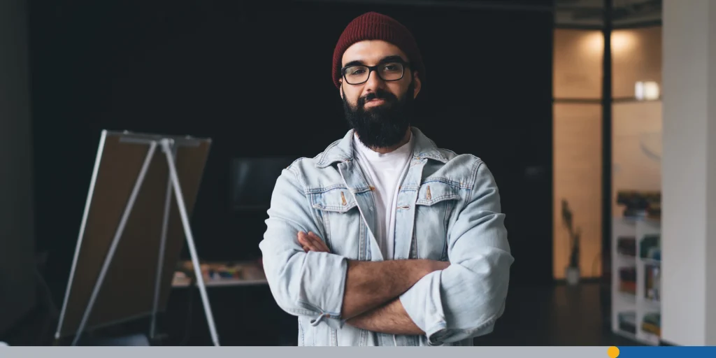 Confident man in casual wear standing in modern office