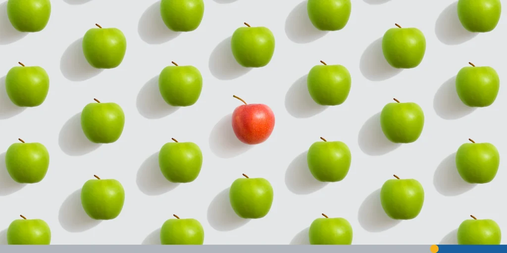 Fruit food pattern, green apples and one red on a white background
