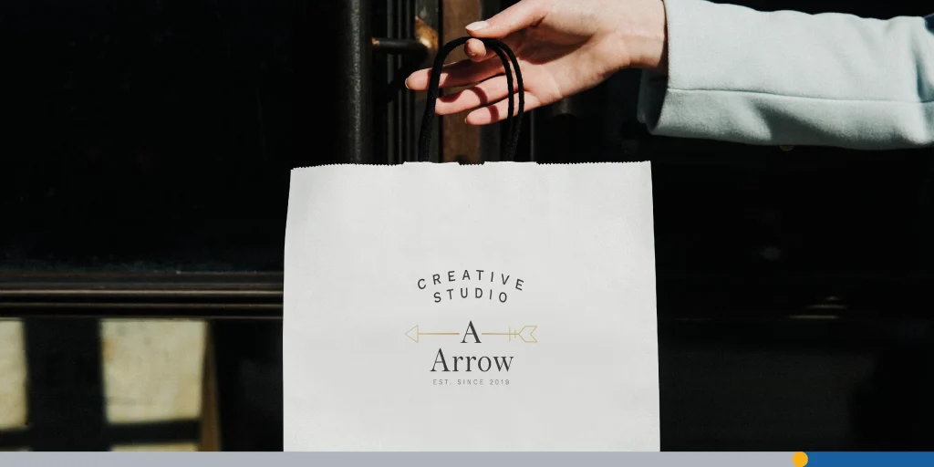 Hand carrying a paper bag
