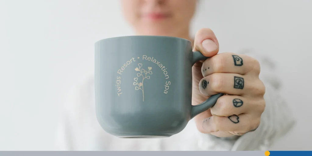 Person holding a custom mug