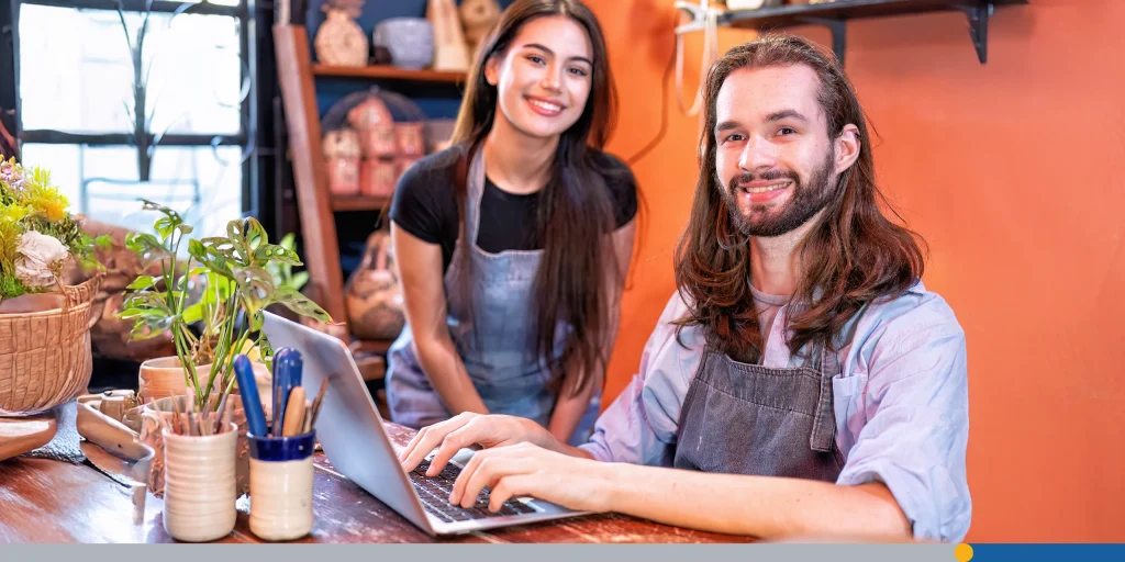Women and man own pottery business use laptop happy smiling 