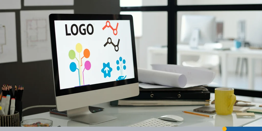 Workplace of web designer with computer monitor standing on desk
