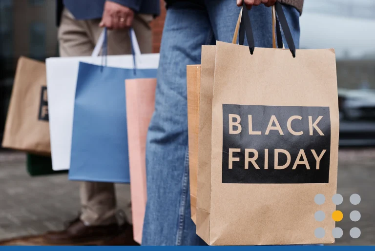 Close up of couple holding Black Friday shopping bags