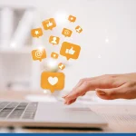 Woman working on a laptop exploring tips for social media marketing for small business