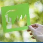 Hand holding up a eco-friendly logo design