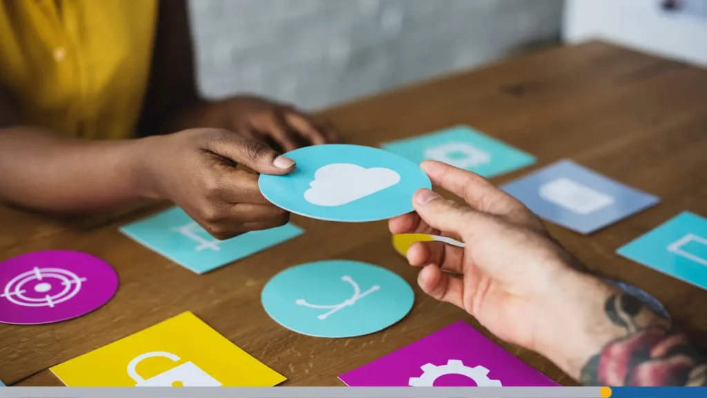 One hand passing a cloud icon to another