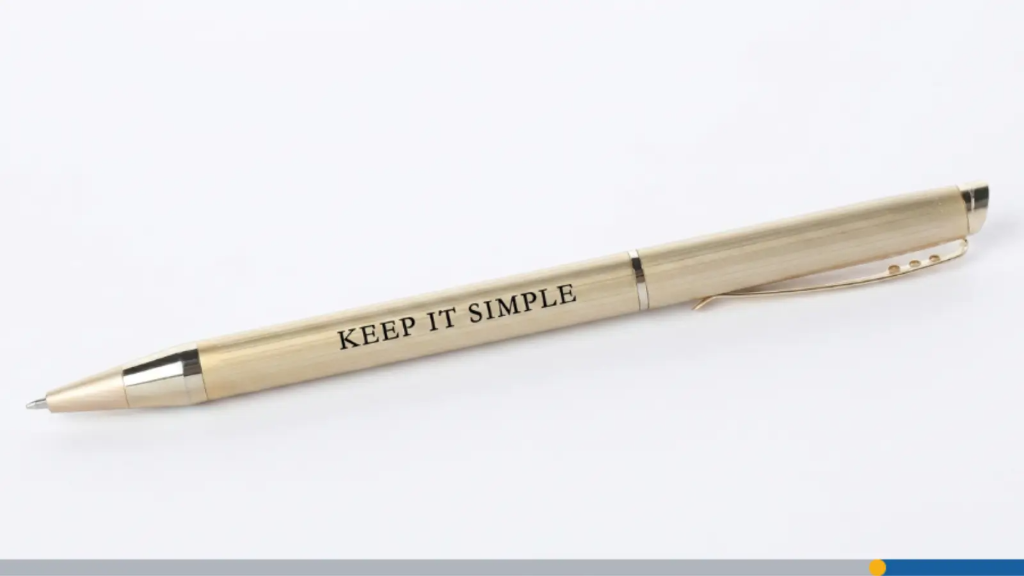 A gold pen with the words keep it simple printed across it, representing the best promotional items.