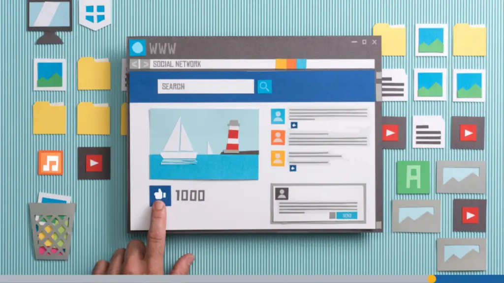 A close-up photo of someone designing a branded website with cardboard cut-outs to explore an online brand identity.