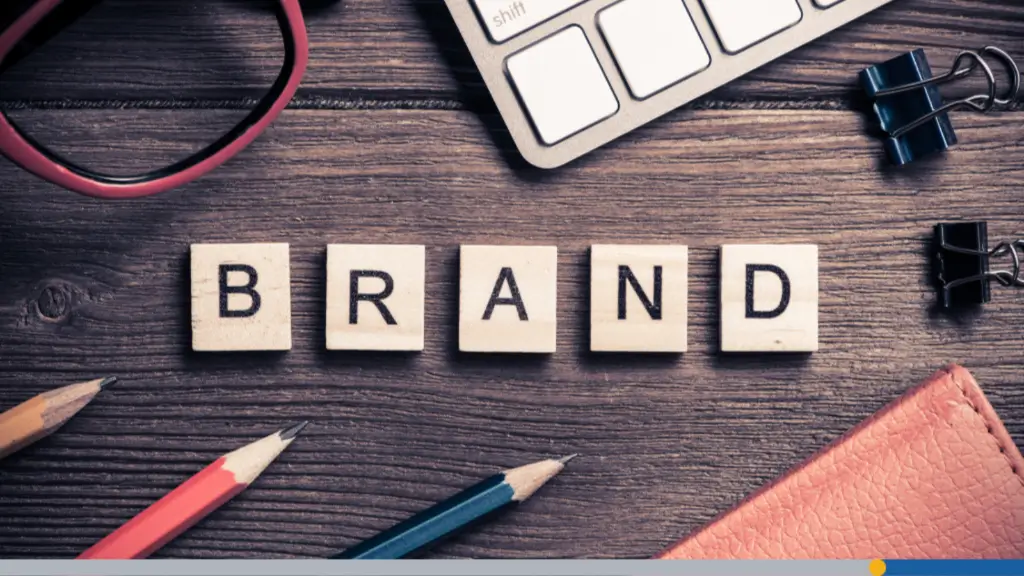 Small wooden pieces arranged to spell out the word brand, symbolizing how to make your own brand online.