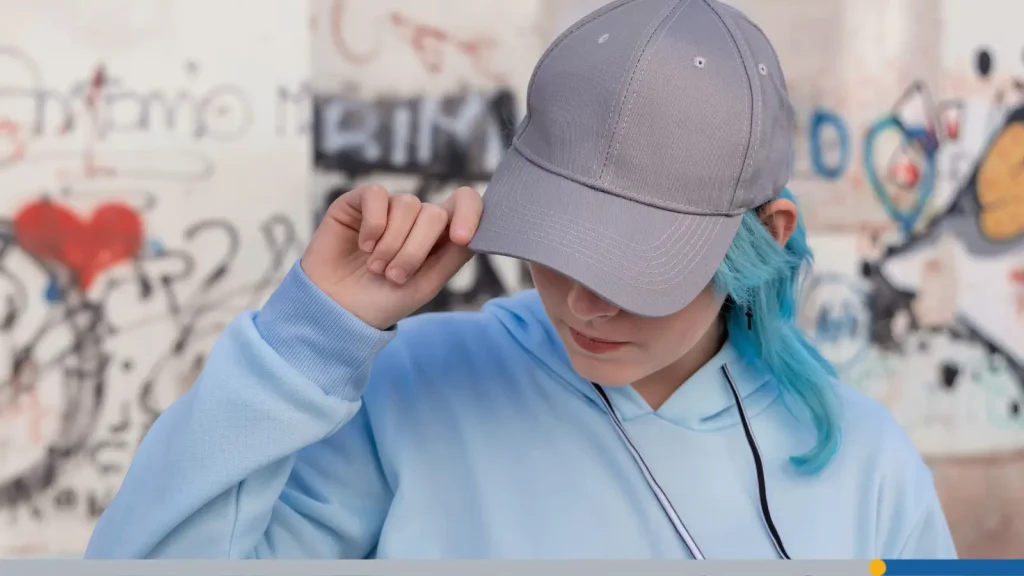 Person wearing a custom hat logo design