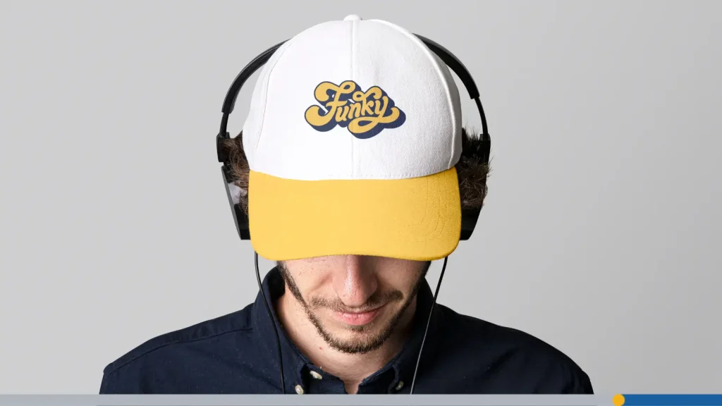 Man wearing a baseball hat and headphones