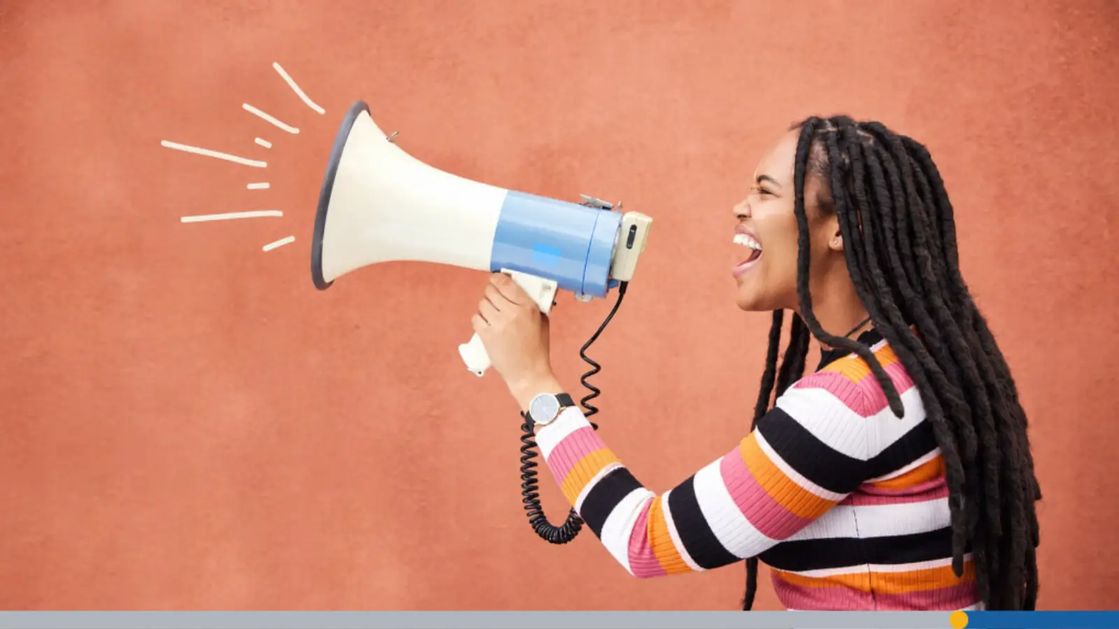 A young woman using a megaphone to share ideas on branding for small businesses.