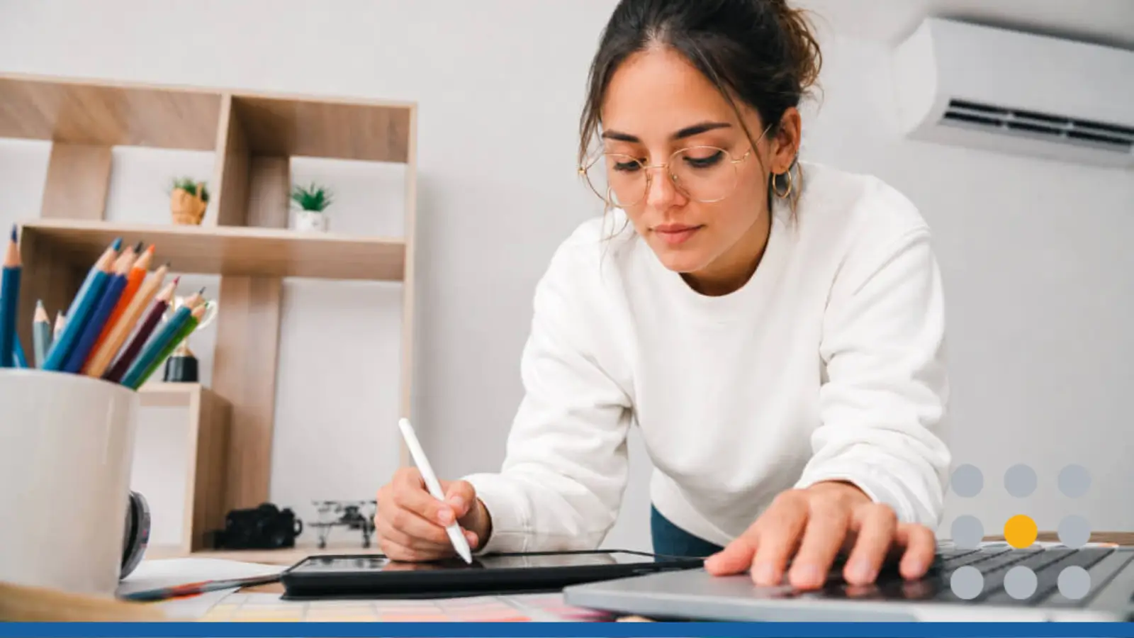 A young woman testing color combinations as she learns to create your own brand.
