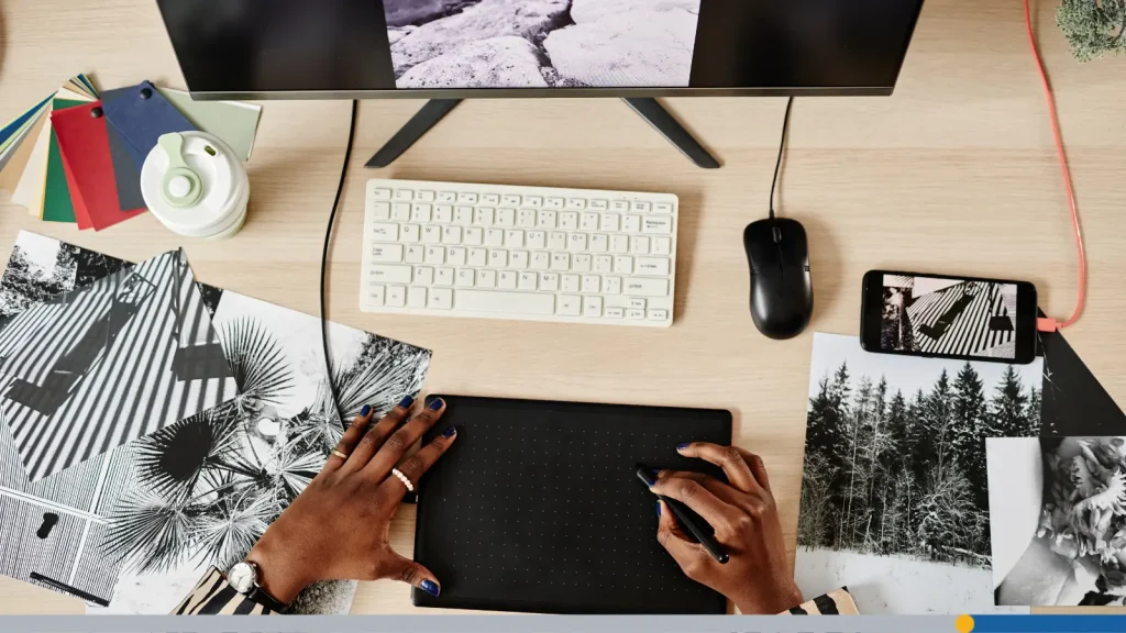 Person designing an image on a pad