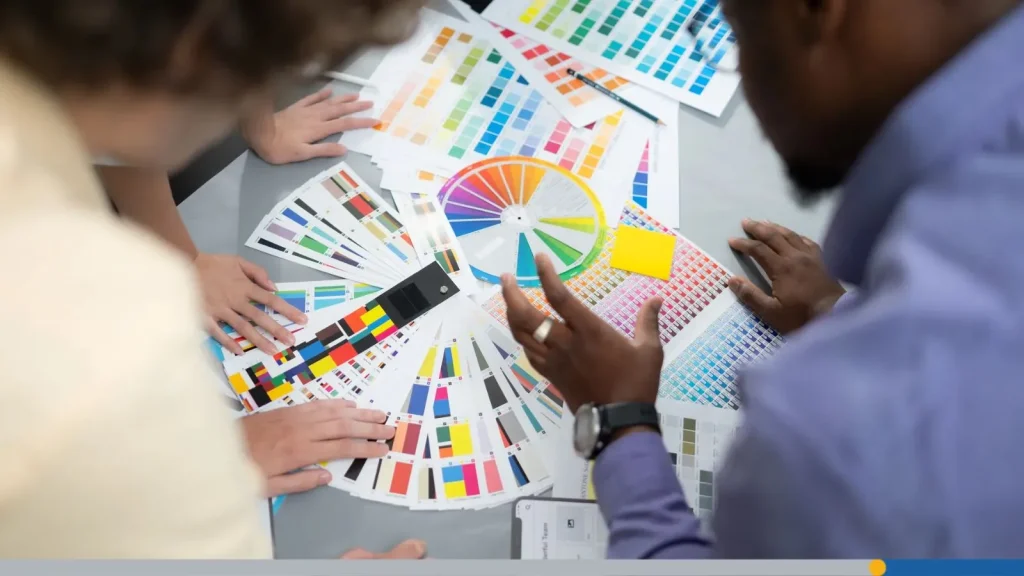 A team working on color charts, picking the right one for their business campaign.