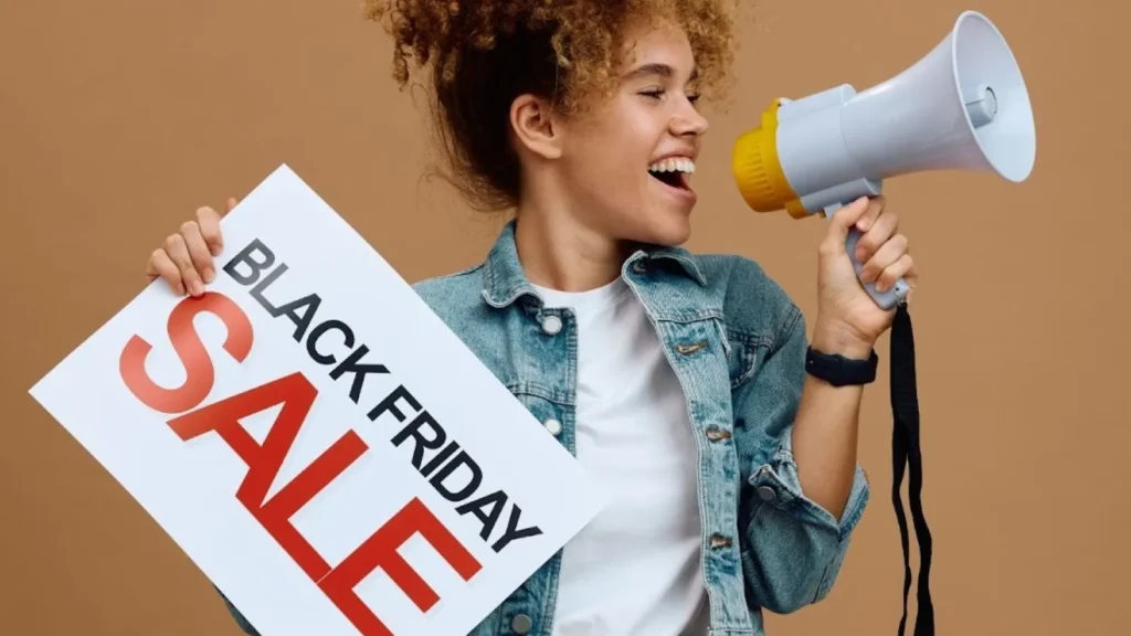 Small business owner promoting a Black Friday sale with a megaphone