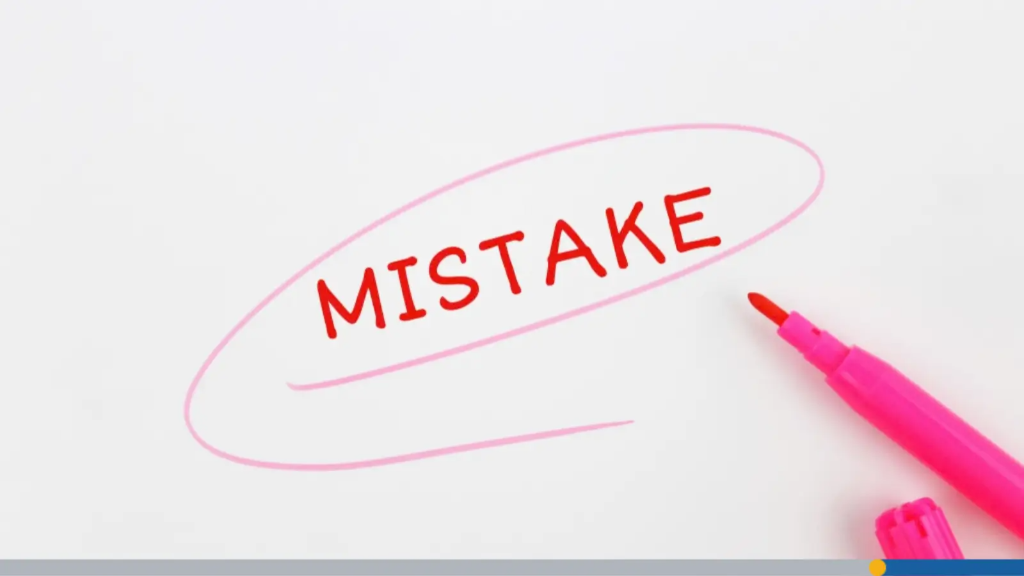The word "MISTAKE" written in red text and circled with a pink marker on white paper, representing common errors to avoid when you name your business.