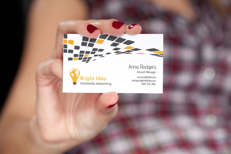 woman holding business card
