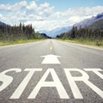 open road with "start" displayed on pavement