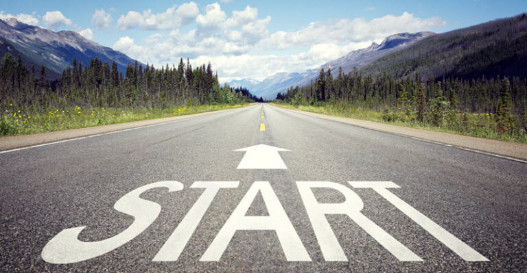 open road with "start" displayed on pavement