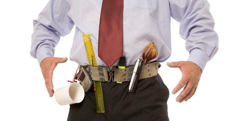 Man with an office supply tool belt marker coffee mug ruler scissors