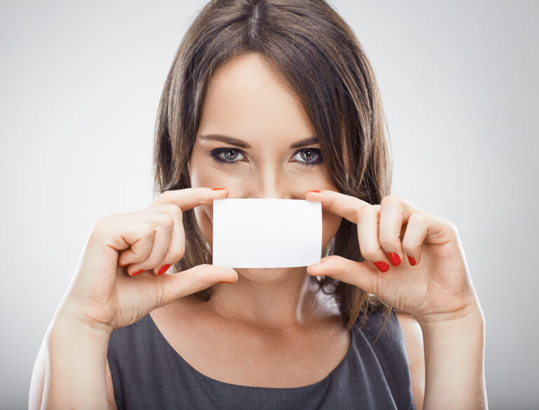 Happy business woman hold credit card. Isolated white background.