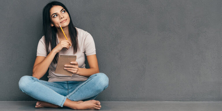 woman sitting and thinking about her logo design