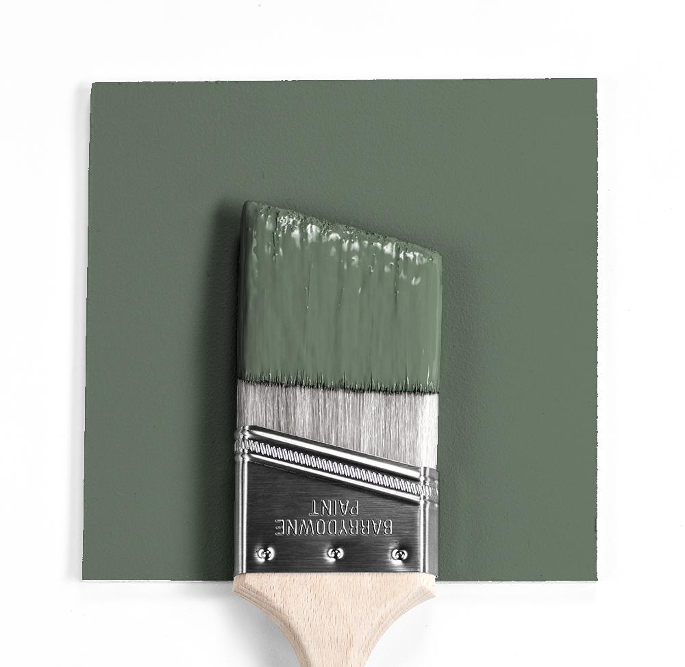 paint brush with dipped in green paint