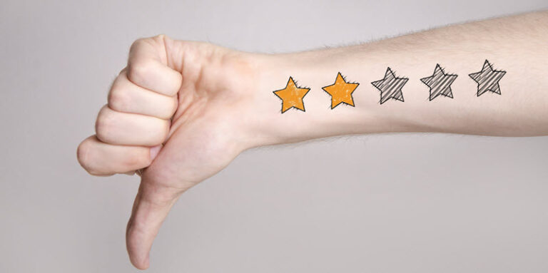 man giving thumbs down with two star review