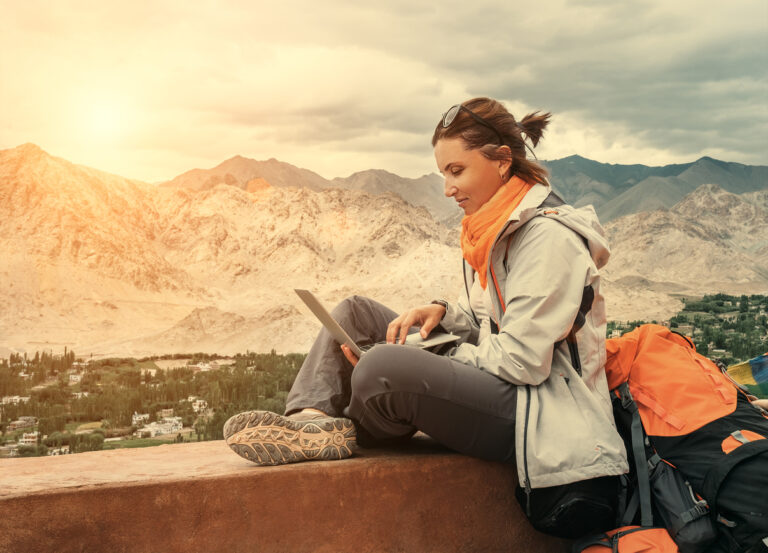 travel blogger on laptop