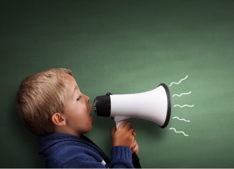 Little Boy Yelling through a megaphone