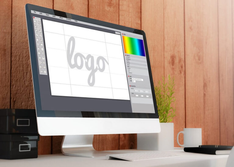 Mac desktop computer with a logo design software on the screen