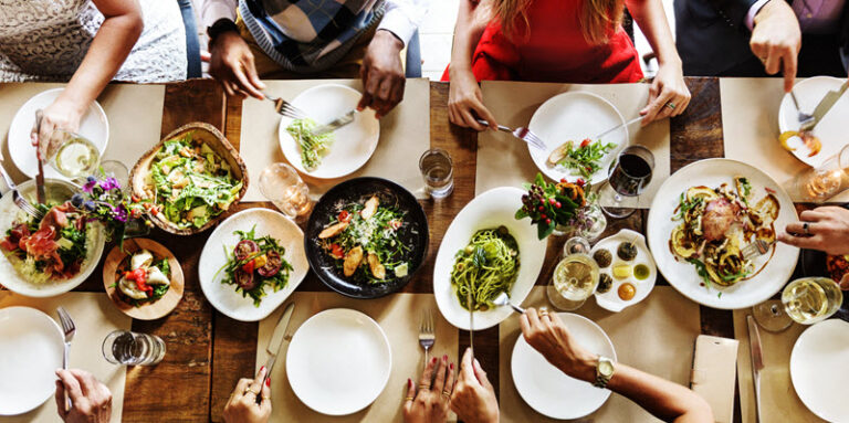 people sitting at a table in a restaurant